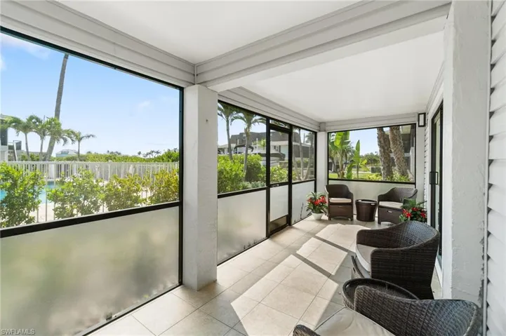 Sunroom with tile patterned floors