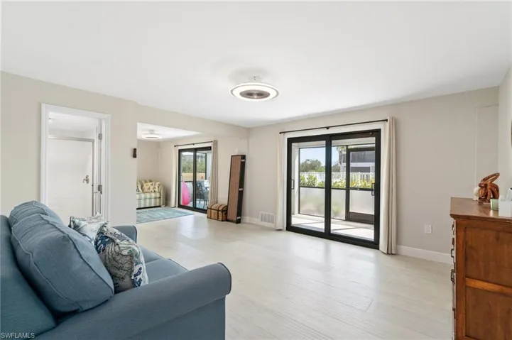 Living area featuring plenty of natural light and light wood-style flooring