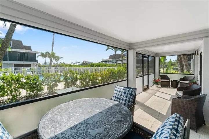 Sunroom with tile patterned flooring