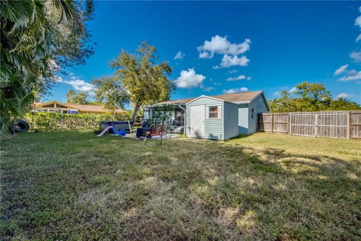 Fenced backyard with a patio
