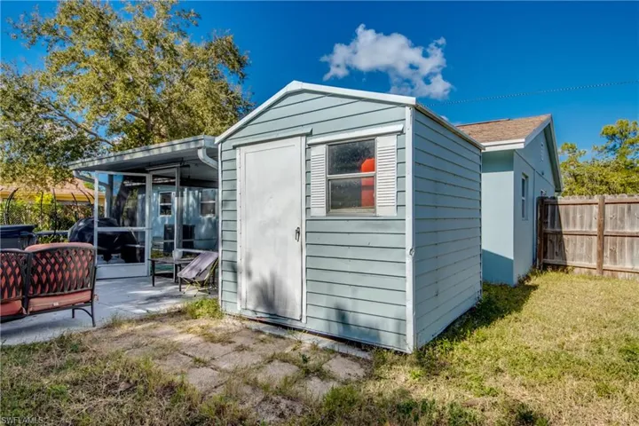 View of shed with a sunroom