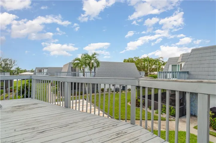 Wooden deck featuring a yard