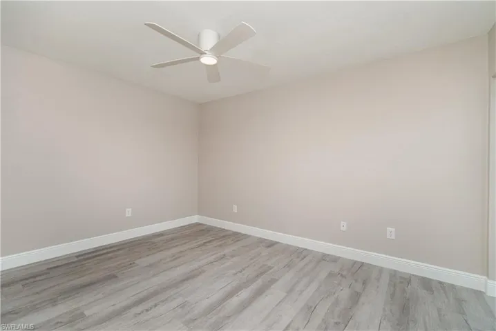 Spare room featuring light wood finished floors and ceiling fan