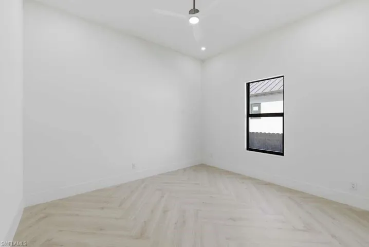 Unfurnished room with parquet flooring, recessed lighting, and a ceiling fan