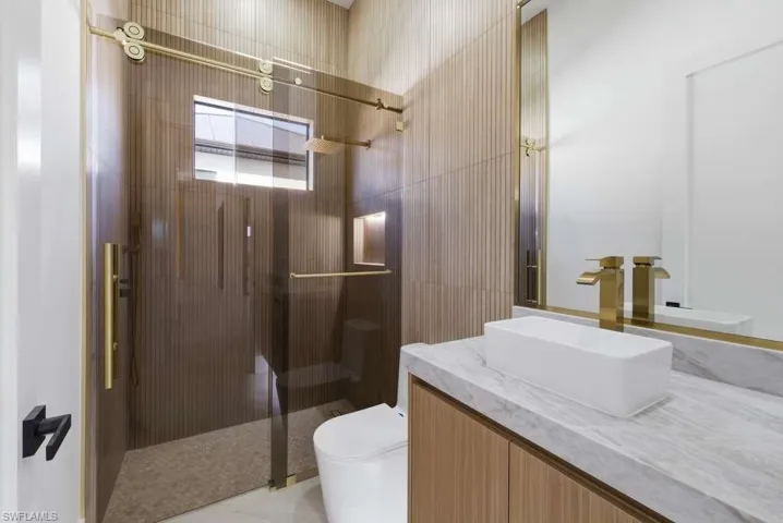 Full bath with vanity and a stall shower