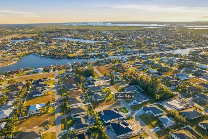 View of property location with a large body of water and nearby suburban area