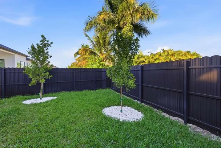 View of fenced backyard