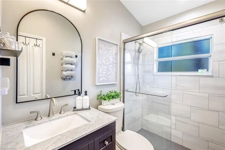 Bathroom featuring vanity and a stall shower