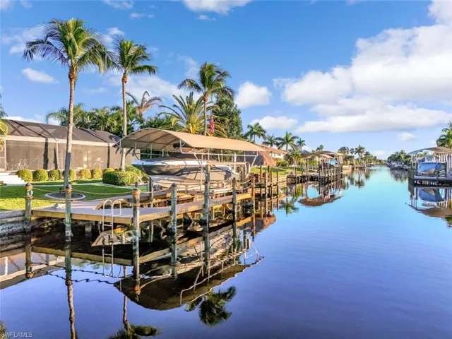 Dock with boat lift and a water view