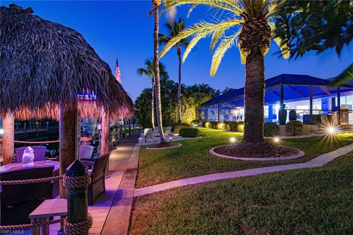 Surrounding community with a yard and a patio