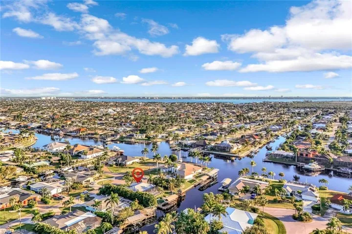 Aerial perspective of suburban area with a large body of water