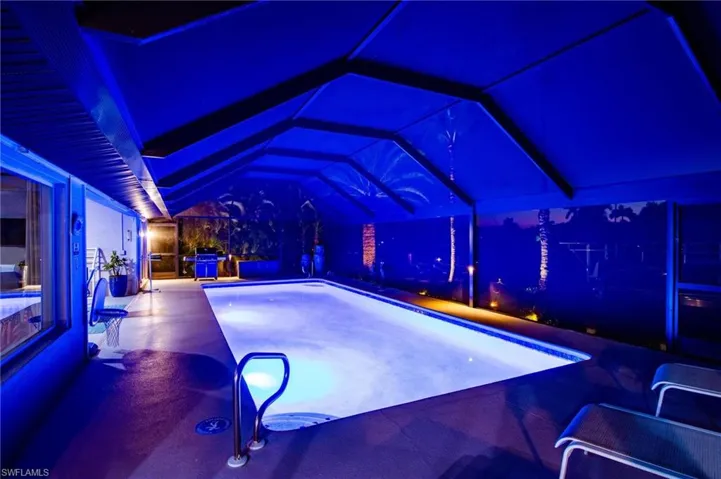 View of pool featuring a lanai, a pool, and a patio area