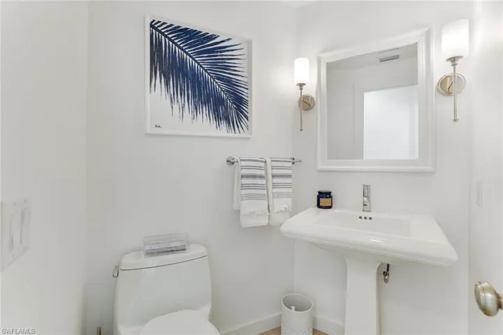 Bathroom with toilet and baseboards