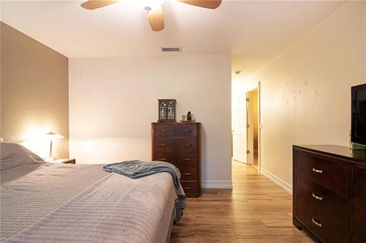 Bedroom featuring light wood-type flooring and a ceiling fan