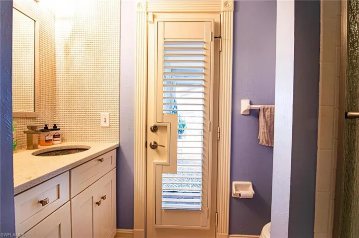 Full bathroom featuring vanity and a shower