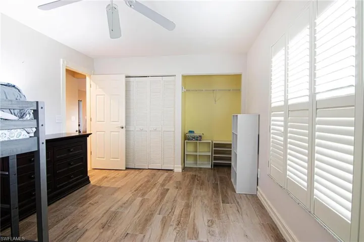 Bedroom featuring light wood finished floors and a ceiling fan