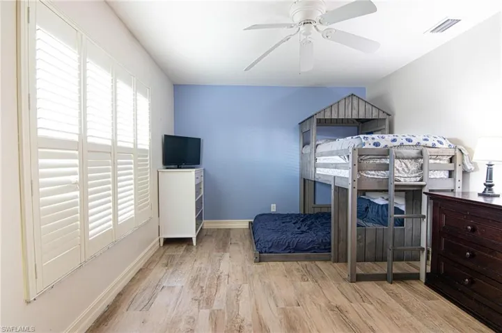 Bedroom featuring light wood-style floors and a ceiling fan