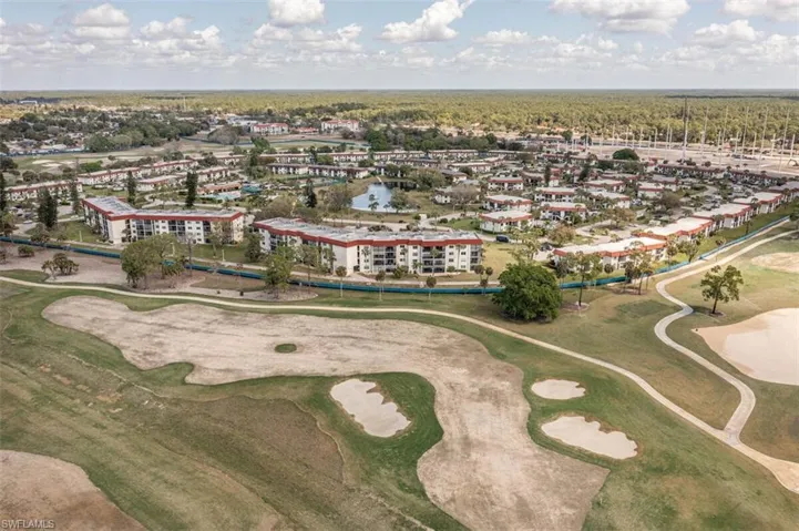 Aerial overview of property's location featuring a coming soon (only pay if you play) golf course and the 532 unit condo  complex with  a large heated pool and a catch and release lake . Not to mention the tennis, pickleball, a very active clubhouse, and the world's friendlist seniors.