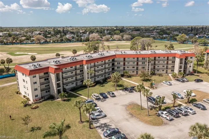 Aerial view of condo buildings and a coming soon golf course