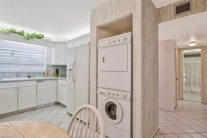 The stacked washer and  dryer are very conveniently located
