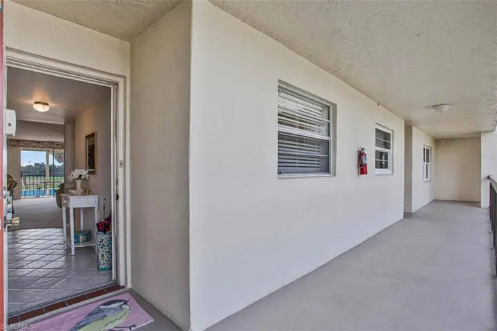 Property entrance with stucco siding