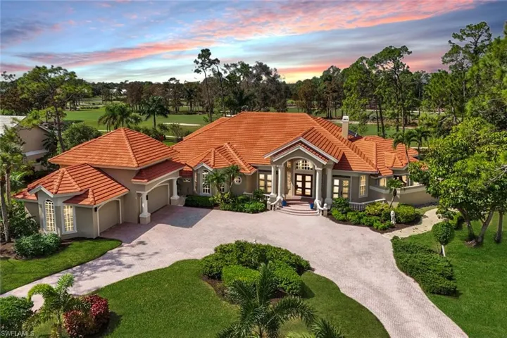 Mediterranean / spanish house with french doors, a yard, and a garage