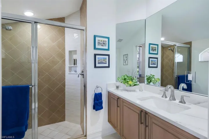 Bathroom featuring vanity and walk in shower