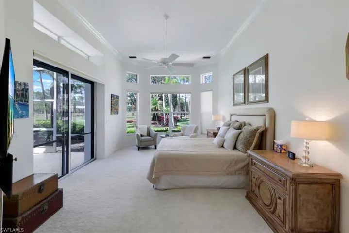 Carpeted bedroom with crown molding, access to outside, and ceiling fan