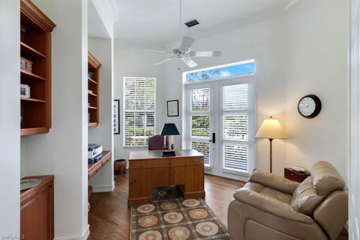 Office with french doors, crown molding, dark hardwood / wood-style flooring, and ceiling fan