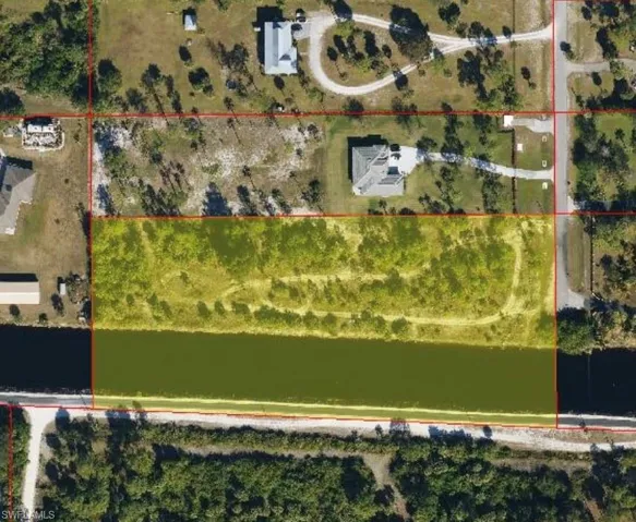Aerial overview of property's location featuring property boundaries highlighted