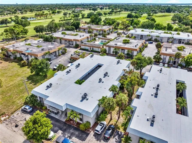Aerial perspective of a multi-unit property featuring a flat roofline