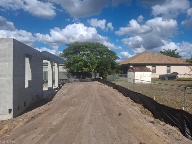 View of property exterior with concrete block siding