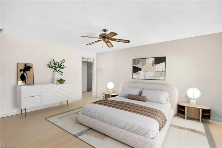 Virtually Staged Bedroom with ceiling fan and light wood-type flooring