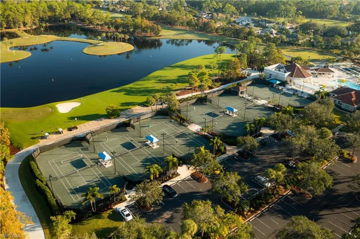 Drone / aerial view of a large body of water and a local golf course
