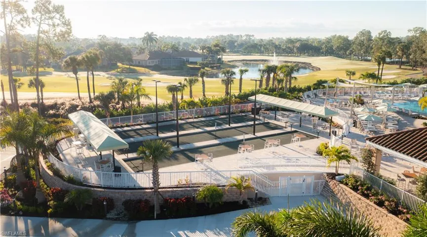 Drone / aerial view of a golf club and a nearby body of water