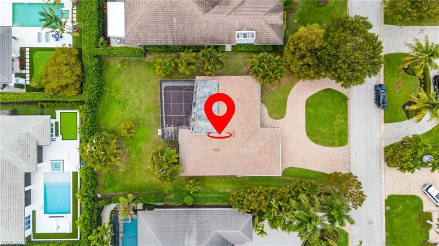 Southern exposure on a .32 acres homesite in the Moorings with private beach club access.
