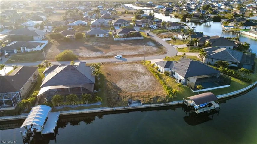 Aerial perspective of suburban area with a nearby body of water