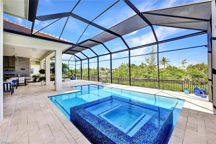 View of pool featuring an in ground hot tub, natural gas pool heater