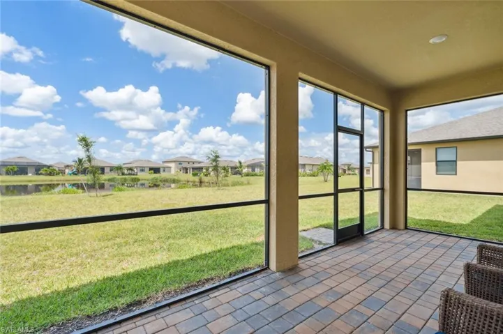 Unfurnished sunroom featuring a residential view