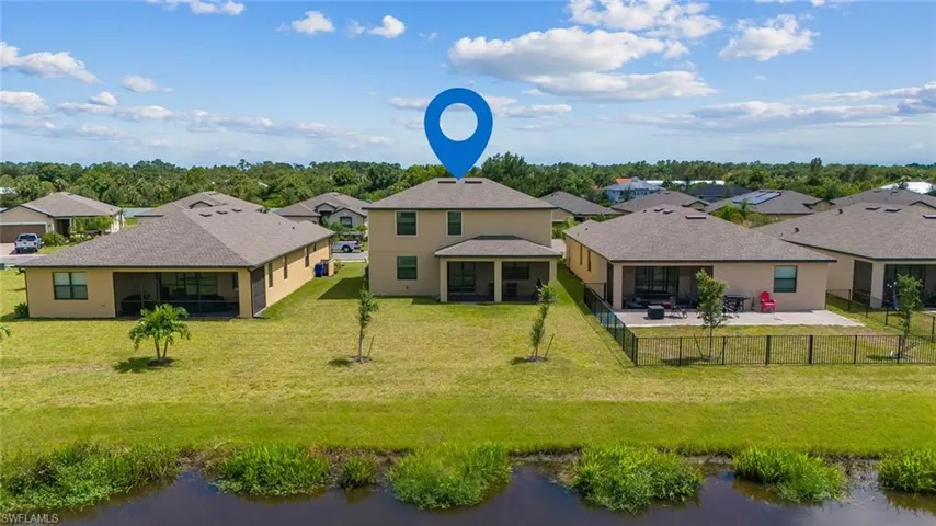 Aerial view of residential area with a nearby body of water