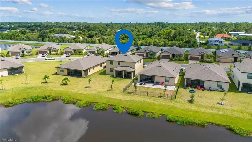 Aerial view of residential area with a nearby body of water