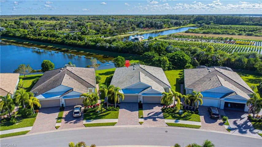 Birds eye view with water views and oversized lot