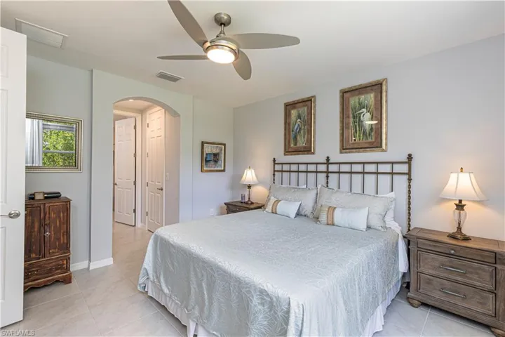Primary En-Suite with tile floors and ceiling fan