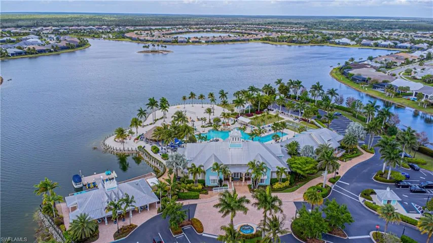 Birds eye view of property with a water view