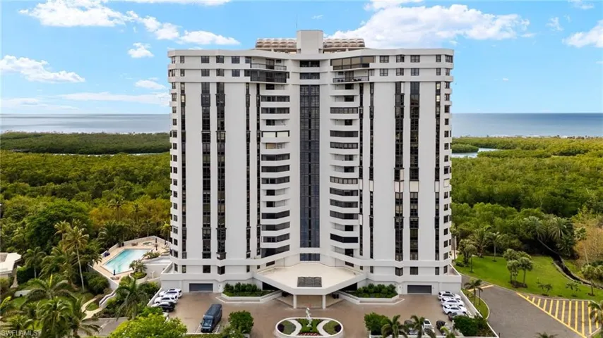 View of apartment building / complex with a water view