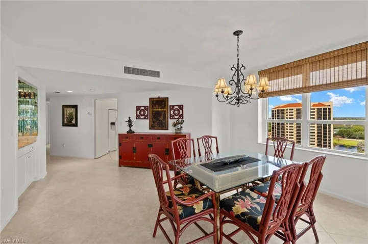Dining space featuring a chandelier and light tile patterned floors