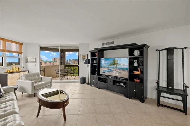 Living area with light tile patterned floors