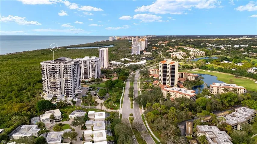 View of urban area featuring a nearby body of water and apartment complex / building