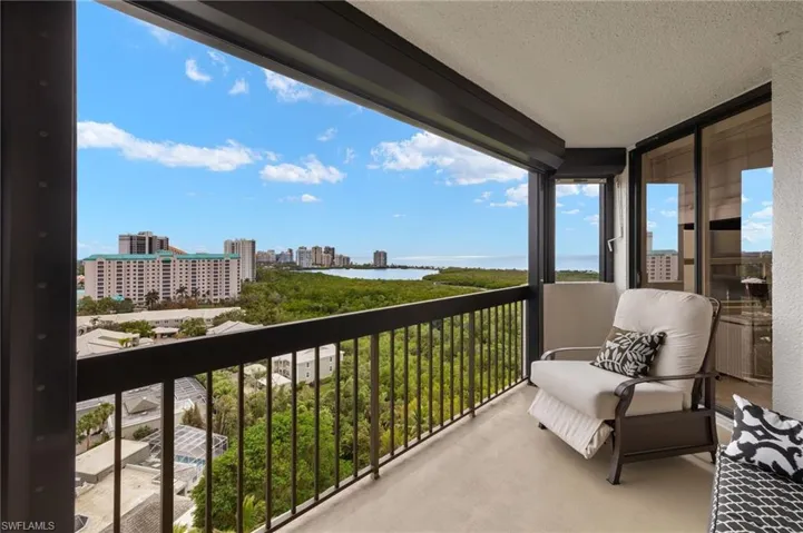 Balcony with a water view and a city view