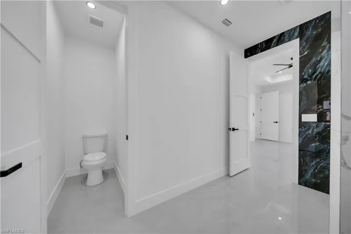 Bathroom with toilet and recessed lighting